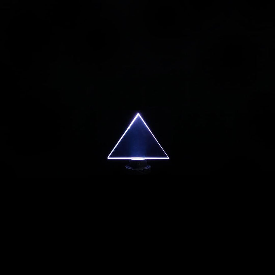 Triangle acrylic light painting blade creating bold, geometric light trails in long exposure photography