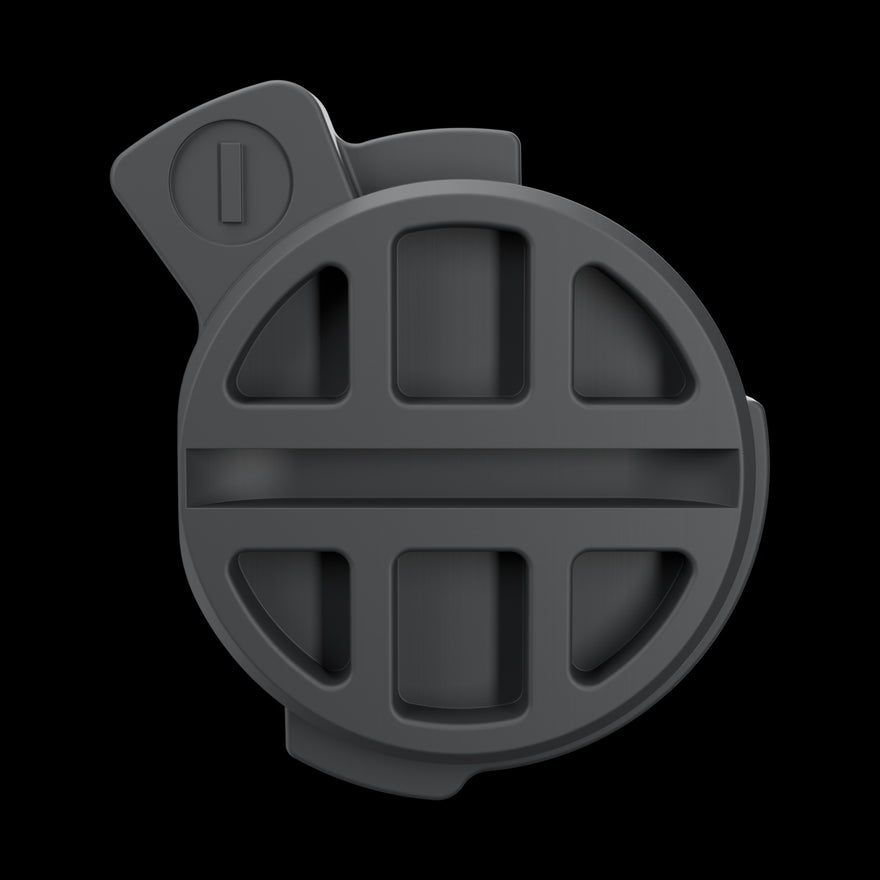 Battery Door straight on: ribbed outer face with the locking tab and its slot, on black.