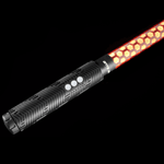 Close-up of the Honeycomb Saber Accessory in orange connected to an RGB Critter BT flashlight, showing texture and build details for flow arts, light painting, and festivals like Burning Man.