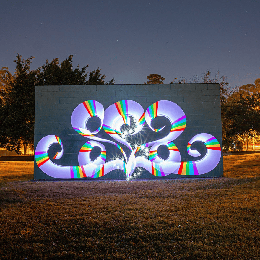 Light painting artwork of glowing white and rainbow swirls made with the Light Painting Tube