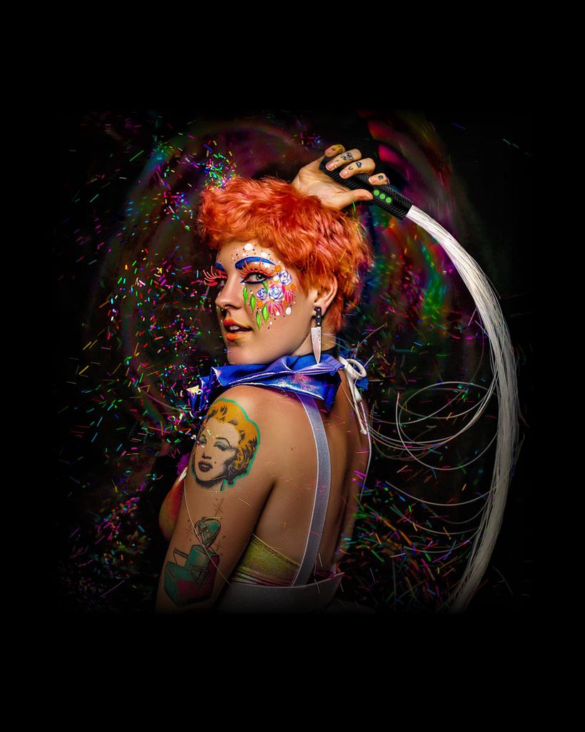 Performer spinning a glowing BitWhip fiber optic whip