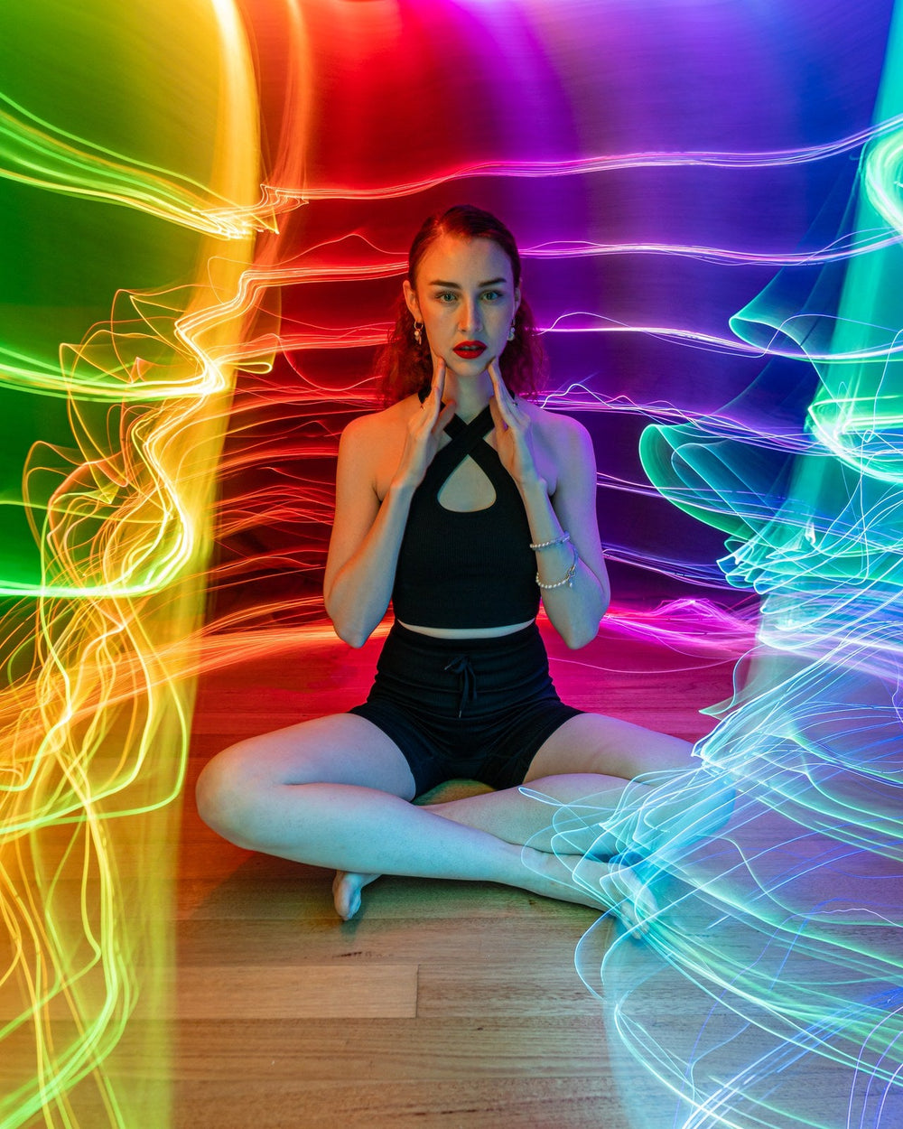 Light painter framed by rainbow BitWhip fiber optic light trails. Photo: Stephen Knight.