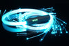BitWhip 200-fiber optic whip glowing ice blue, coiled with sparkling fiber tips