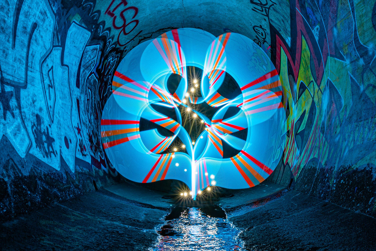 Blue and red butterfly saber light painting in a tunnel
