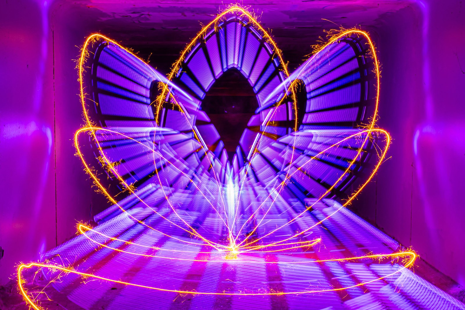 Purple Lumi Saber light trails with golden sparkler holder loops. Photo: Stephen Knight.