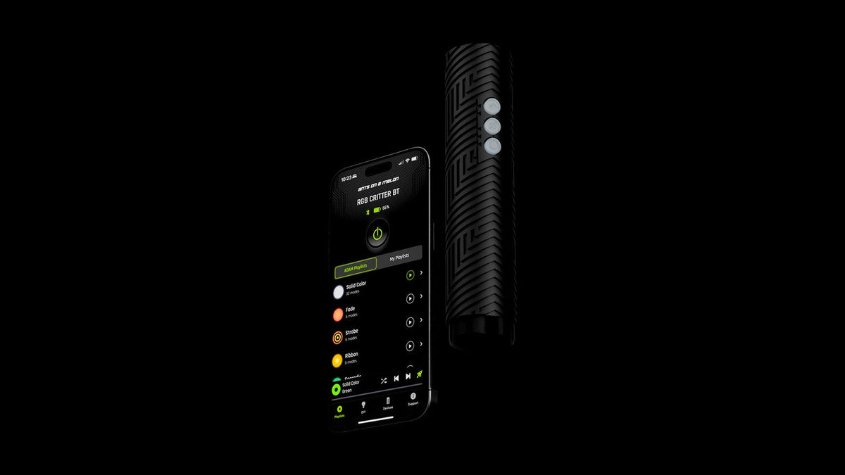 RGB Critter BT flashlight beside a phone running the Ants on a Melon app playlist screen