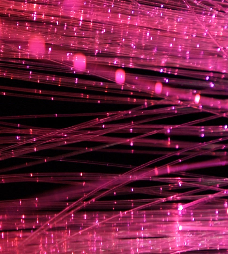 Close-up of glowing sparkle fiber optic strands