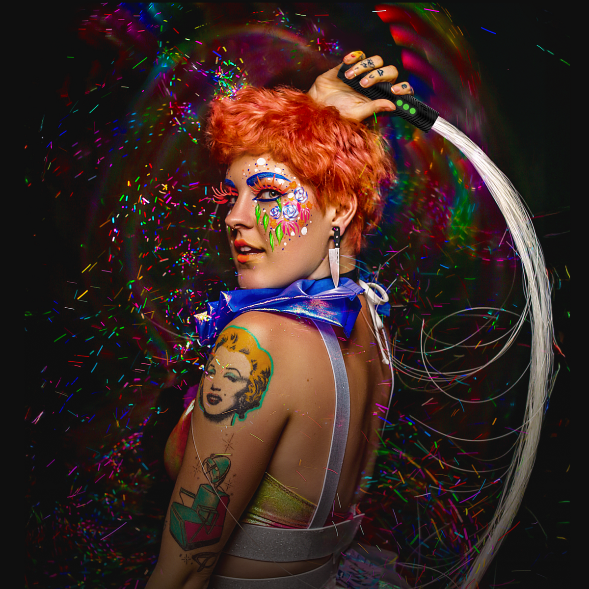 Woman sitting with light painting in background.
