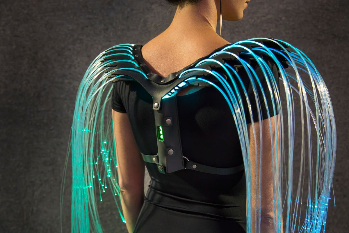 Fiber optic costume harness glowing cyan, by Natalie Walsh