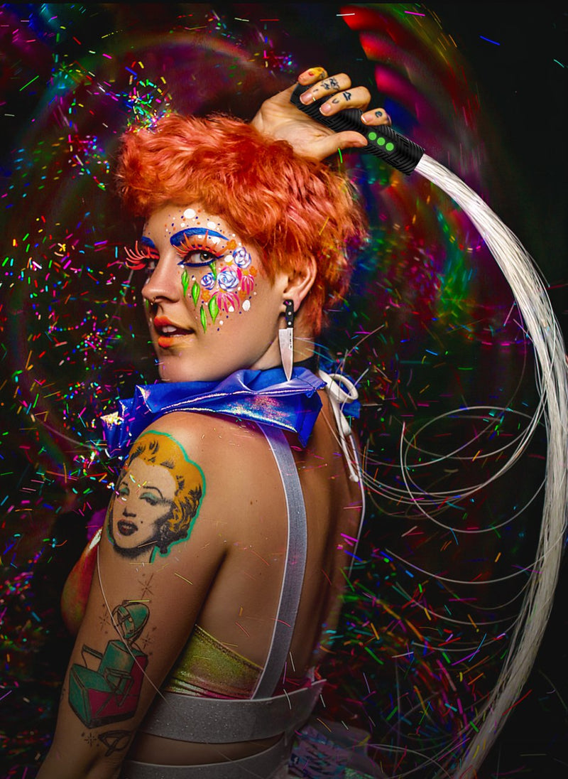 Flow artist spinning a glowing BitWhip fiber optic whip powered by the RGB Critter BT