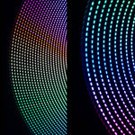 Two real light painting trails made with the Dots Combo Light Painting Tube: side 1 on the left, side 2 on the right, each spun in a circle on black.