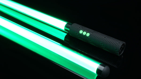 Two glowing green saber blades with an RGB Critter BT handle on black