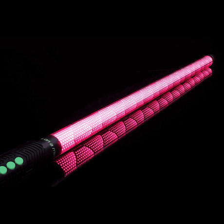  Hive Saber Accessory in pink connected to an RGB Critter BT flashlight, creating vibrant trails for flow arts, performances, and light painting at festivals like Burning Man. 