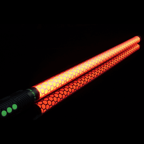  Honeycomb Saber Accessory in orange connected to an RGB Critter BT flashlight, creating glowing trails for flow arts, light painting, and performances at festivals like Burning Man. 