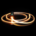 RGB Jupiter Rope accessory connected to an RGB Critter BT flashlight, glowing orange, designed for flow arts, light painting, and performances at festivals like Burning Man.