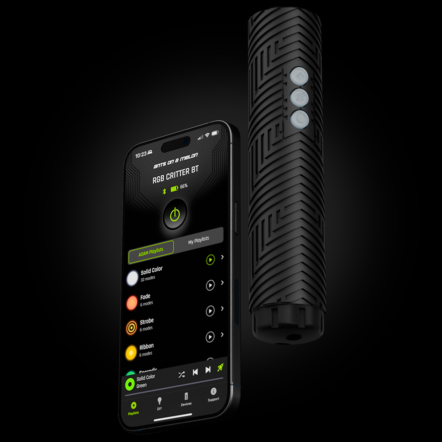 Front angle of the RGB Critter BT flashlight next to a phone displaying the Ants on a Melon app for light painting control